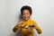 Happy black kid boy playing plane model on white background