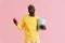 Happy black man with pop corn and soft drink in cinema portrait