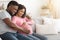 Happy black married couple waiting for baby