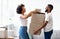 Happy Black Spouses Packing Boxes For Moving To New Apartment