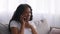 Happy Black Teen Girl Talking On Cellphone While Relaxing On Couch