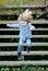 Happy blond child jumping wooden stairs