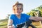 Happy blond guy in straw hat and and blue t-shirt