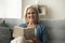Happy blonde senior retired woman reading paper book