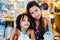 Happy bonding of two sisters in a cafe, sisters chilling in coffee-shop