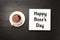 Happy Boss`s Day greeting card design with cup of coffee on wooden table, flat lay