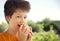 Happy boy biting the apple, A child with a fruit. Kid eating fresh pear