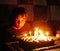 Happy boy blowing out candles for his eighth birthday, chess player