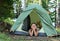 Happy boy in camping tent