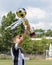 Happy boy child soccer player champion in football championship with trophy gold cup with golden football ball