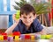 Happy boy with colourful blocks