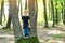 Happy boy discovering nature. Joyful child playing on the park at sunny day. Happy little boy at the forest. Family walk at wild