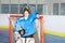 Happy boy goaltender posing after hockey match