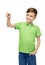 Happy boy in green polo t-shirt pointing finger up