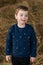 Happy boy in  haystack portrait