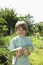 Happy Boy Holding Marrow In Garden