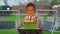 Happy boy holds a cake with burning candles. Birthday party.