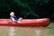 Happy boy kayaking on the river