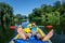 Happy boy kayaking on the river on a sunny day during summer vacation