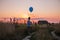 Happy Boy makes his wishes and dreams Outdoors with Helium Balloons. Run along the yellow field. Beautiful summer card, birthday