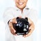 Happy boy with piggy bank