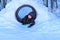 Happy boy playing in a snow tunnel.