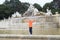 happy boy posing by the Neptune fountain in the garden of the Sc