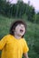 Happy boy in rain summer outdoors