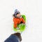 Happy boy riding sled on snow in winter