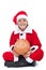 Happy boy in santa costume with piggy bank