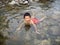 Happy Boy Swimming in the Creek