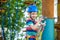 Happy boy on the zip line. proud of his courage the child in the