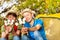 Happy boys with hats hold marshmallow sticks