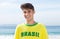 Happy brazilian sports fan at beach