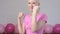 Happy breast cancer survivor woman fighting breast cancer making boxer`s punches -breast cancer awareness concept