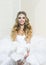 Happy bride with bridal makeup look. Bride in white wedding dress. Love yourself forever