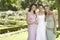 Happy Bride With Friends In Garden