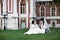 Happy bride and groom on lawn