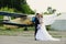 Happy bride and groom. Old airplane in the background