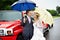 Happy bride and groom at wedding and red limo