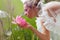 Happy bride smelling a lotus