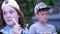 Happy brother sister in the park, outdoors eating ice cream. Happy Brother and Sister. Happy teenager Family.