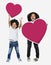 Happy brothers jumping with heart icons