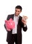 Happy business man holding piggy bank with Australian Dollars