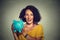 Happy business woman, bank employee holding piggy bank