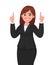 Happy business woman pointing index finger up. Woman raising / lifting hand to upward.