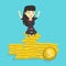 Happy business woman sitting on golden coins.