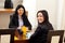 Happy business women at meeting table