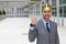 Happy businessman with a crown in office space