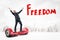 Happy businessman raising arms on red hoverboard with `Freedom` sign on white city skyscrapers background